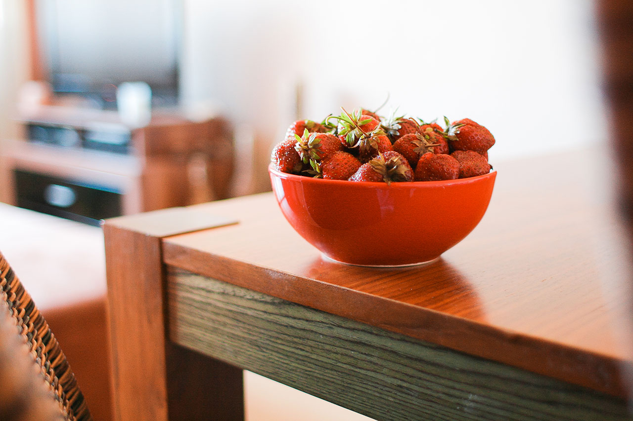 A bowl of strawberries on the table