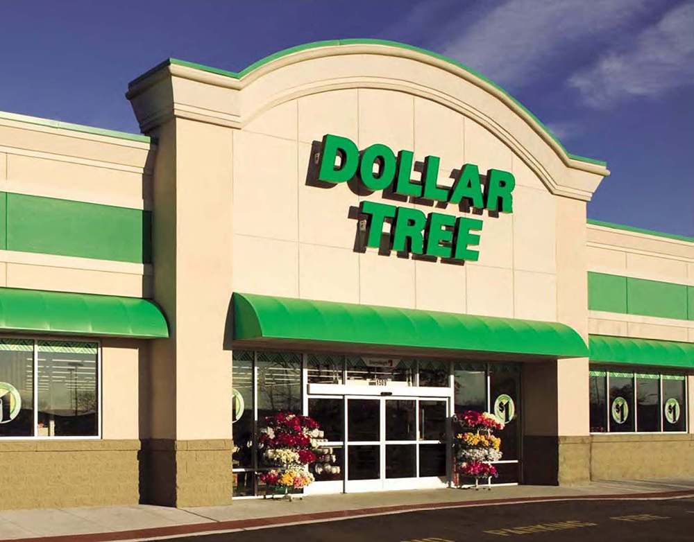 A dollar tree store front with green awnings.