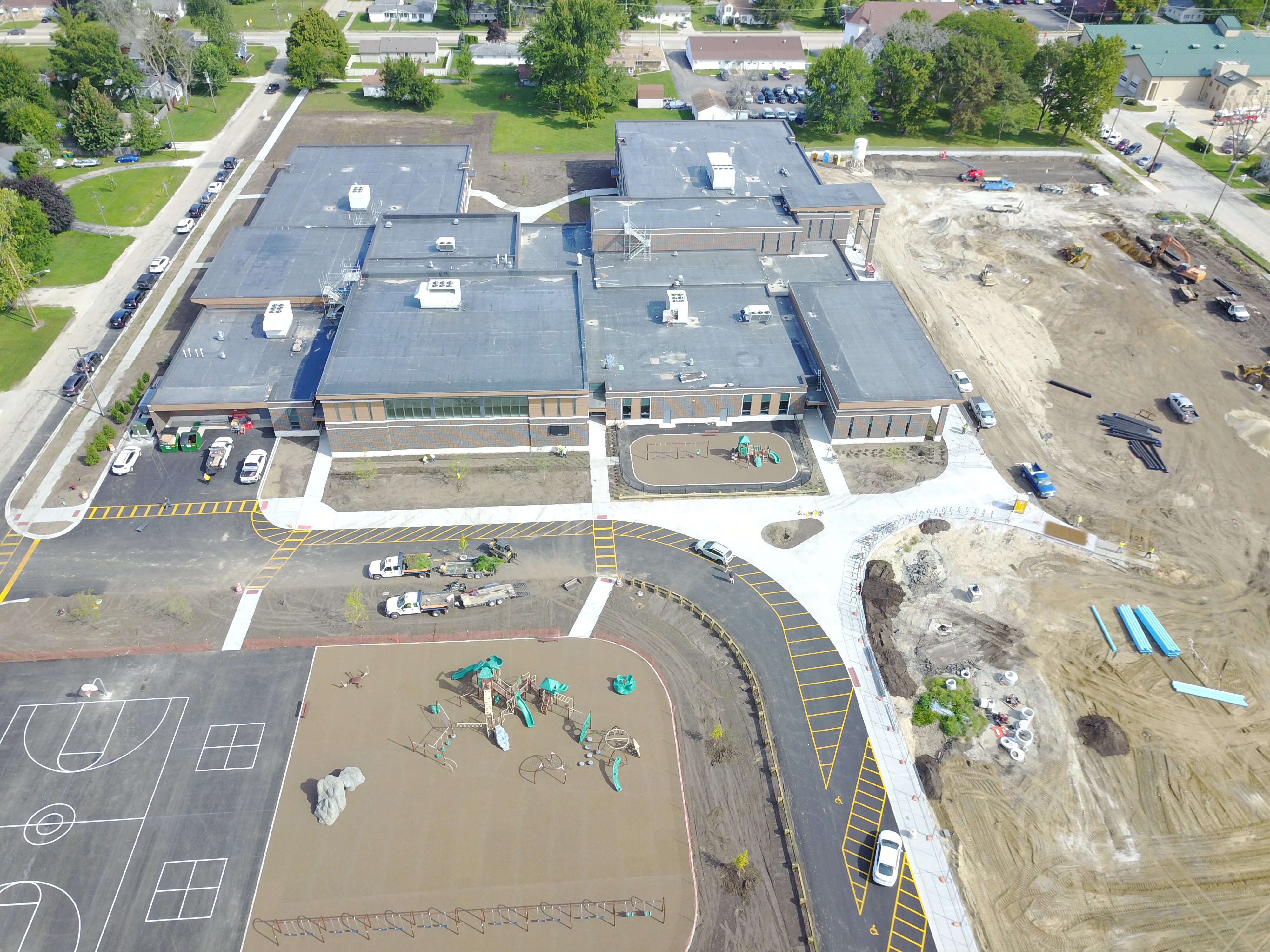 An aerial view of a school with construction in progress.