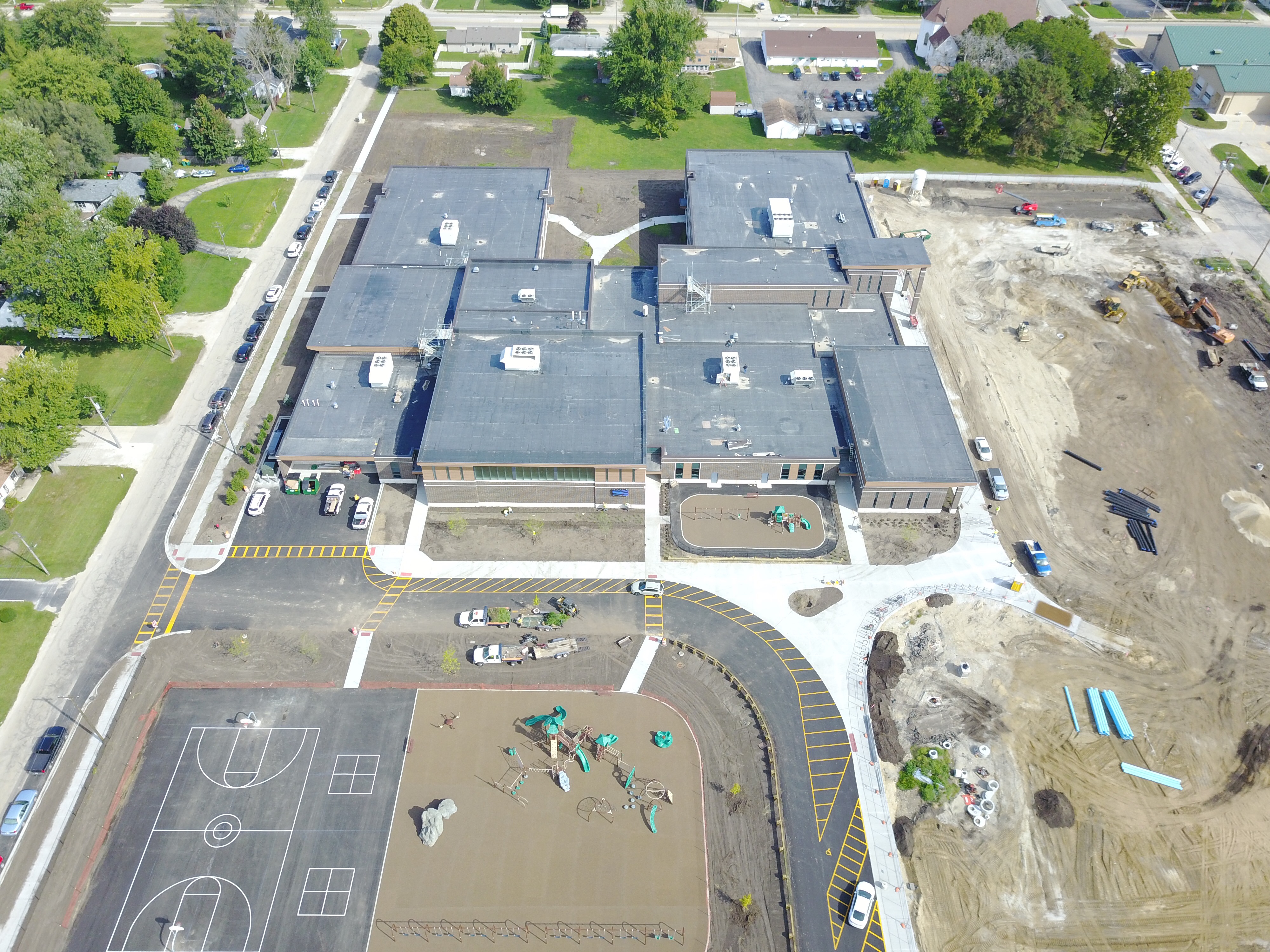 An aerial view of a school with construction in progress.